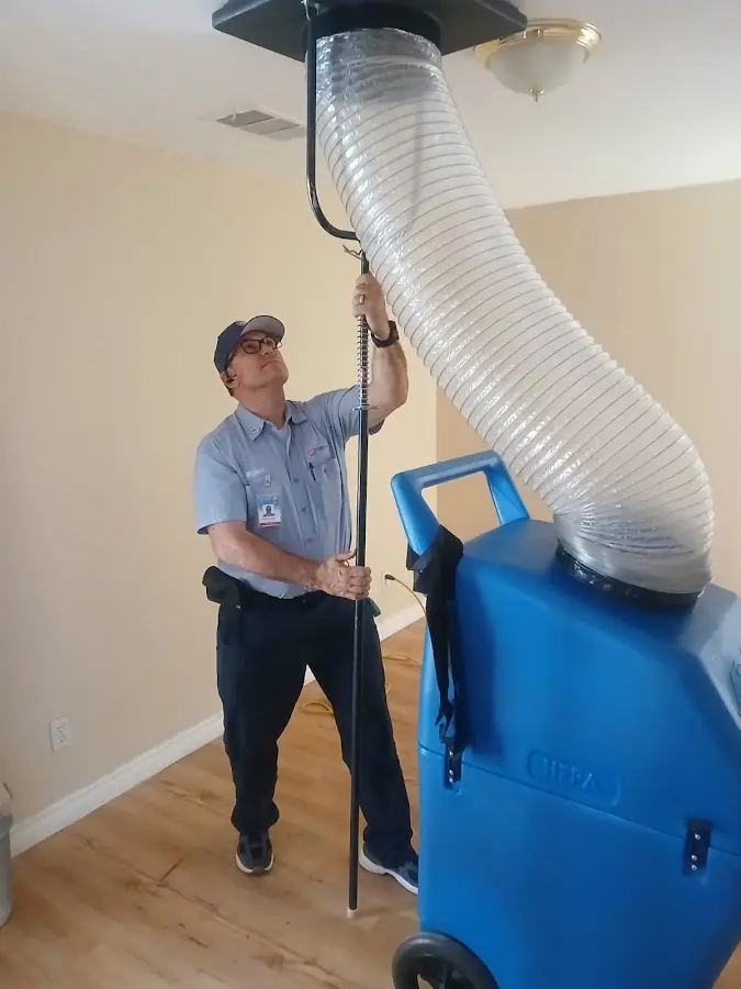 Furnace Tune-Up technician using HEPA equipment in Green Lake